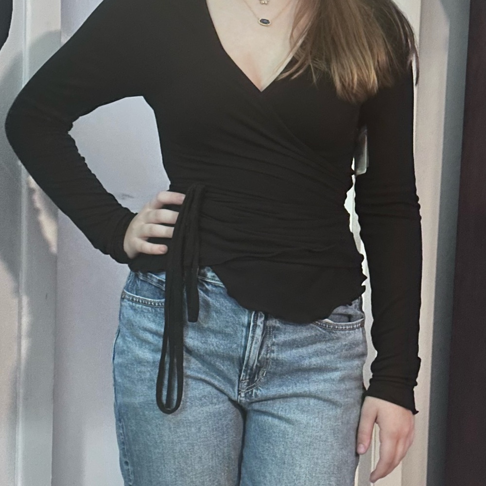 Very flattering Free People Black Wrap Tie Front Long Sleeve Top!